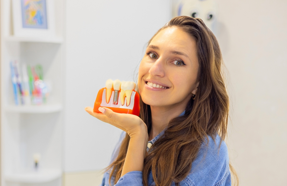 woman or man holding dental implant mockup - Dental Implants in Federal Way WA woman holding dental implant mockup - Dental Implants in Federal Way WA